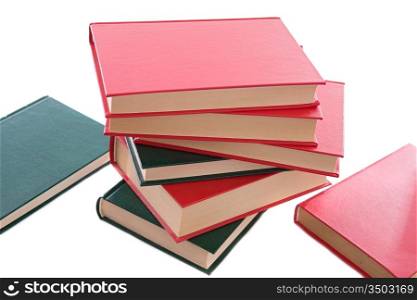 Many books red and green stacked on a white background