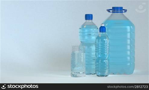 Many bottles and glass of clear water. 3d