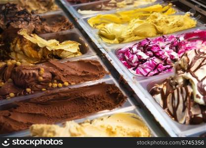 Many boxes of ice cream gelato in a shop