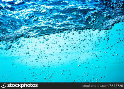 Many bubbles in water close up, abstract water wave with bubbles