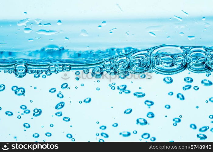 Many bubbles in water close up, abstract water wave with bubbles