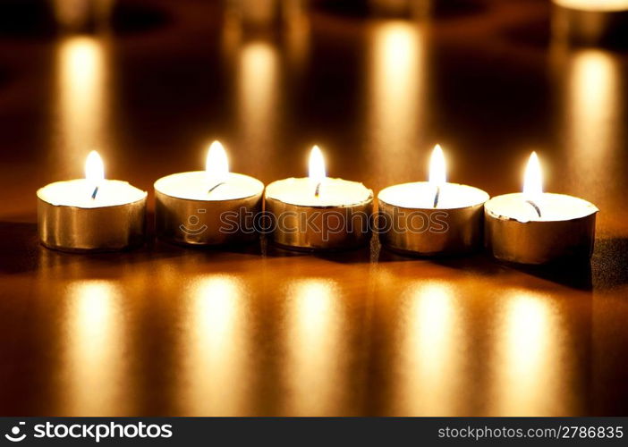 Many burning candles with shallow depth of field