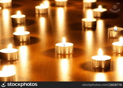 Many burning candles with shallow depth of field