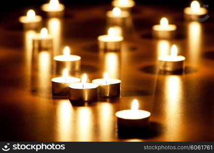 Many burning candles with shallow depth of field