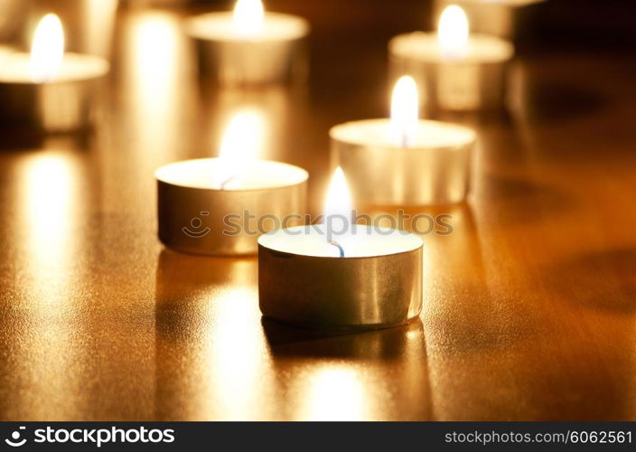 Many burning candles with shallow depth of field