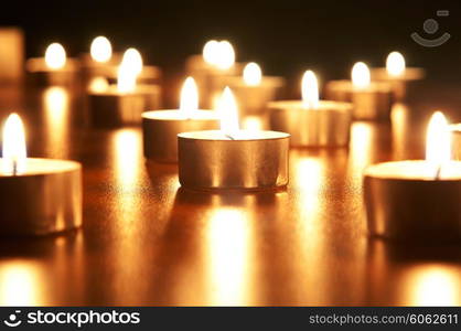 Many burning candles with shallow depth of field