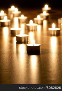 Many burning candles with shallow depth of field