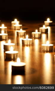 Many burning candles with shallow depth of field