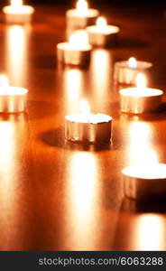 Many burning candles with shallow depth of field