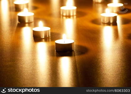 Many burning candles with shallow depth of field