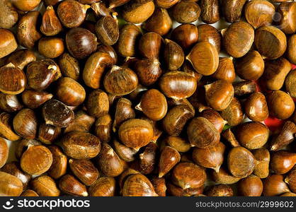 Many chestnuts arranged at the background