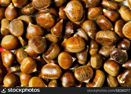 Many chestnuts arranged at the background