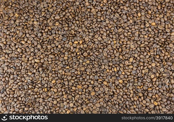 Many coffee beans as background