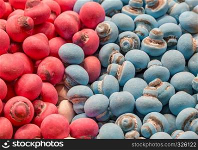 Many colored red and blue candies like a mushroom ready to eat.