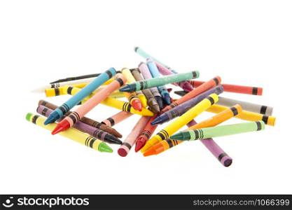 Many colorful crayons isolated over white background