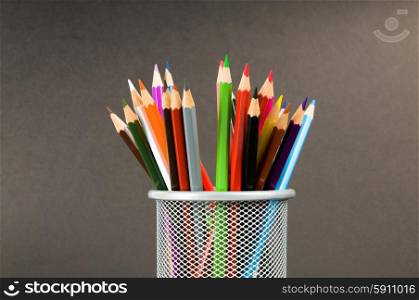 Many colorful pencils on the color background