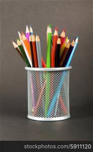 Many colorful pencils on the color background