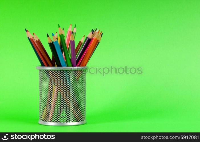 Many colorful pencils on the color background