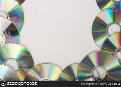 many compact discs with space text white background