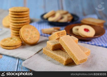 Many cookies are placed on the fabric and then placed on a wooden table.