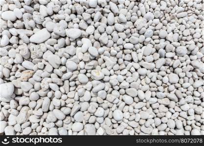 Many different sized grey stones as background