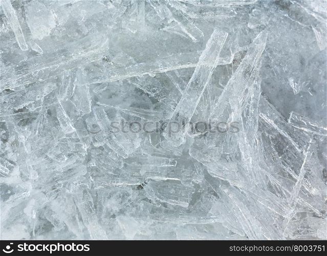 Many elongated pieces of ice closeup. Winter background.