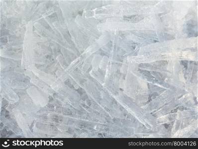 Many elongated pieces of ice closeup. Winter background.