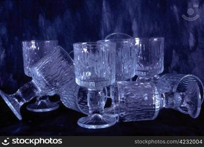 Many empty glasses isolated on paited background