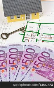 many euro bank notes and plan of a house