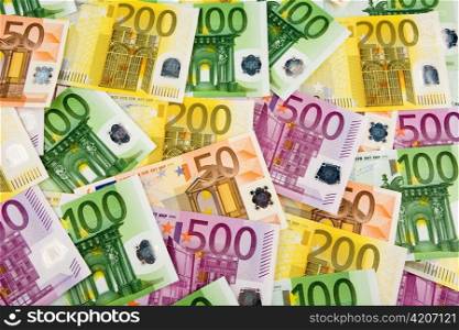 many euro banknotes are next to each other. photo icon for wealth and taxes