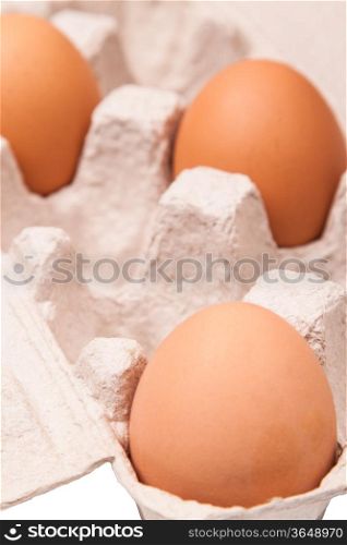 many fresh yellow chicken eggs in container