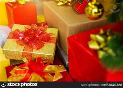 many gifts with abstract green Christmas tree background Decoration During Christmas and New Year.