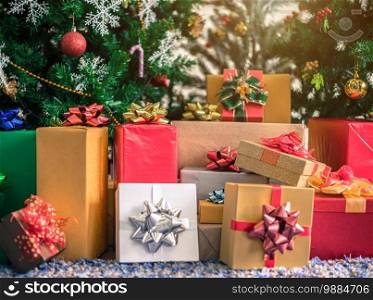 many gifts with abstract green Christmas tree background Decoration During Christmas and New Year. 