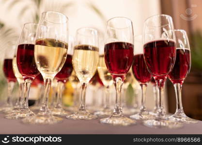 many glasses of wine on the table buffet