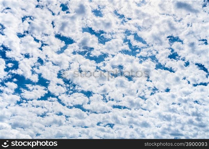 Many little white clouds and blue sky in spring season