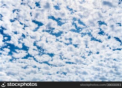 Many little white clouds and blue sky in spring season