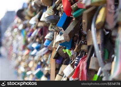 Many Love locks on the bridge in Paris - a symbol of eternal love, friendship and romance. France.