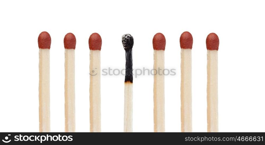 Many matches without burning and a burned match isolated on a white background
