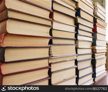Many old books in a book shop or library, education and reading concept