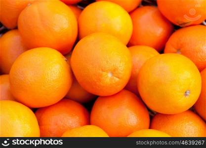 Many oranges stacked with a glowing skin