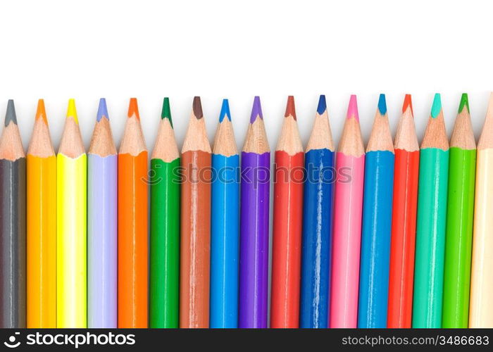 Many pencils of different colors on a over white background