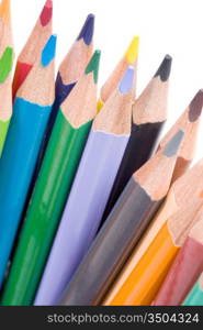 Many pencils of different colors on a over white background