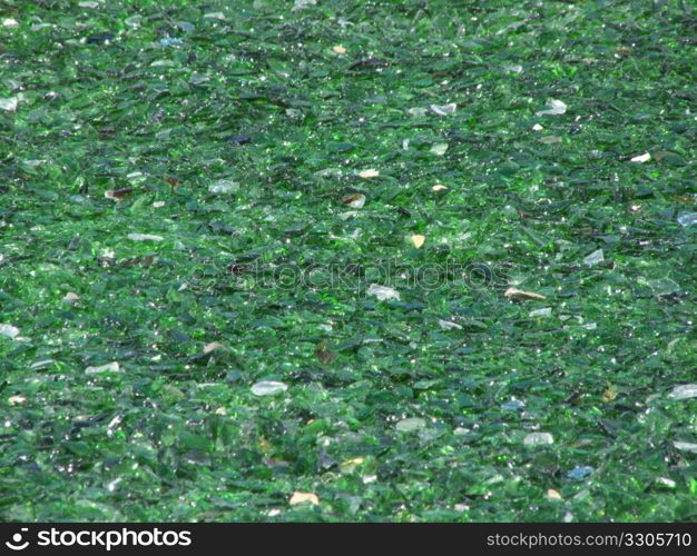 many pieces of broken glass in green