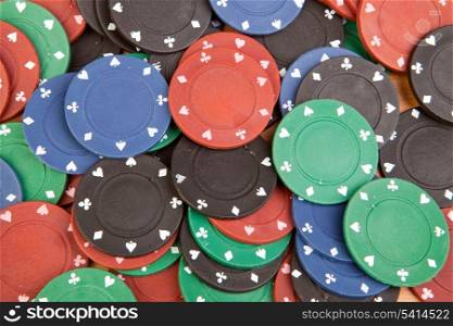 Many poker chips of four different colors