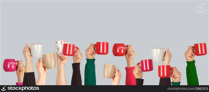 many raised hands up with ceramic cups on a white background, recruitment concept, join our team