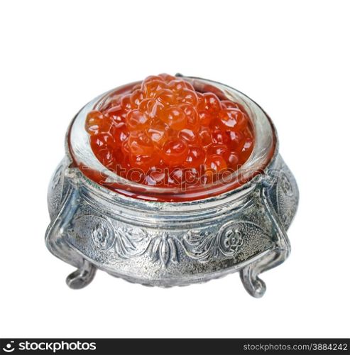 Many red caviar in a silver bowl closeup isolated on white background