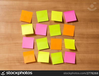 Many reminder notes on the wooden background