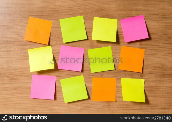 Many reminder notes on the wooden background