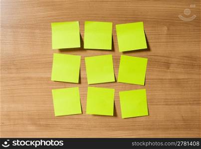 Many reminder notes on the wooden background