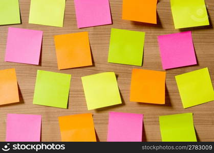 Many reminder notes on the wooden background